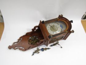 A John Thomas of London reproduction Dutch style wall clock with pendulum and two weights, 66cm tall