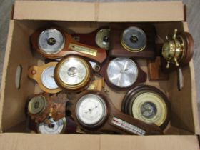 A box containing assorted barometers, mostly modern wall examples (11)