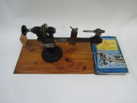 An 8mm watchmaker's lathe for restoration, with a box of various collects and runners, together with