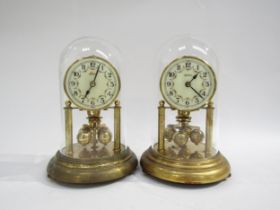 Two near pair brass anniversary clocks under glass domes, one Bentima and other Kesn. Both marked KS