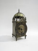 A brass lantern clock marked Coventry Astral, made in England, engraved dial with Roman numerals and
