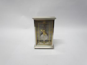 A Jaeger Le Coultre No. 481 mantel clock, visible skeleton movement set with rubies, stainless steel