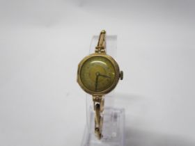 A 9ct gold cased lady's watch with flexible strap (link to strap broken)