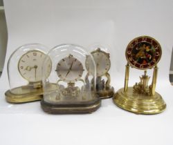 Four assorted anniversary clocks including Kundo electronic and Schatz, one lacking dome
