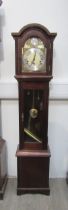 A reproduction mahogany cased Westminster chime Grandmother clock with pendulum and two weights,