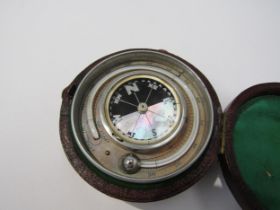 A leather cased compass/hydrometer and stopwatch with mother of pearl compass face and barometer