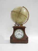A Thwaites of London desk clock with mechanical atlas globe, 41.5cm tall