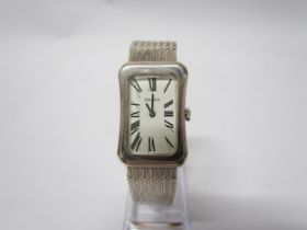 A Tissot silver wristwatch of cushion style, Deco form face, snake link strap, cased