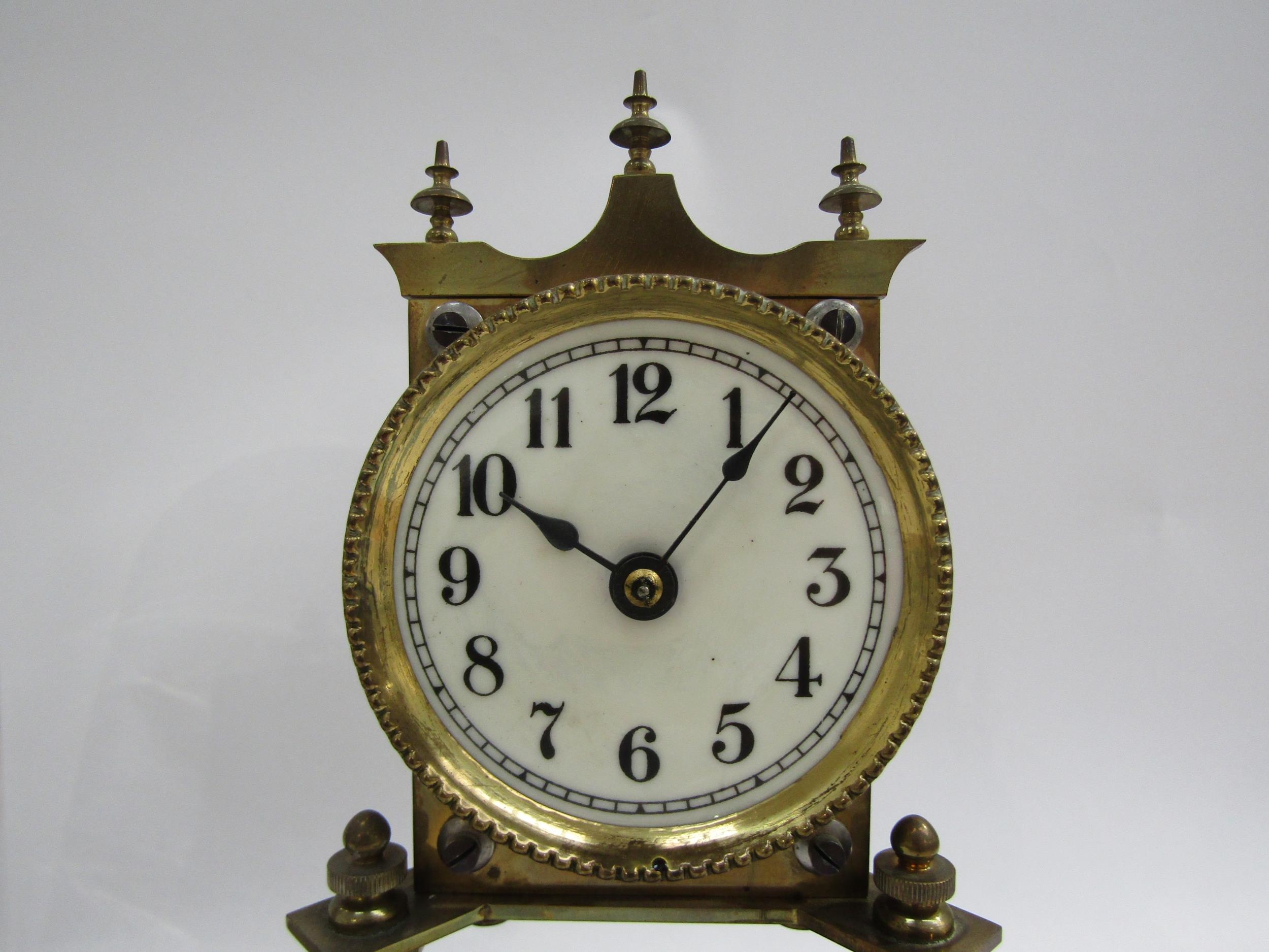 A near identical pair of brass anniversary clocks under glass and plastic domes. Both with white - Image 2 of 5