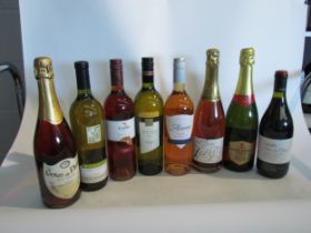 Eight bottles of mixed wines including Cava, Hardy's Chardonnay, Adnam's Cabernet rose, etc