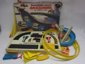 A Matchbox Powertrack Race & Chase slot car racing set with two cars, together with loose