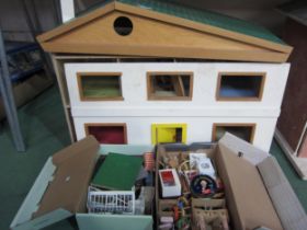 A 1960's two storey dolls house with furniture and Britains Floral Garden items