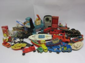 A collection of predominantly 1970s playworn plastic and tinplate toys including Marx plastic