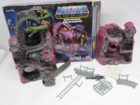 A boxed Mattel Masters of the Universe Snake Mountain action figure playset, housed in original box,