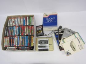 A Commodore C2N Datassette unit together with a large collection of Commodore 64 games and c64 books