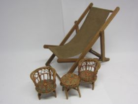 A vintage wood and canvas dolls deck chair and wicker set of table and two chairs