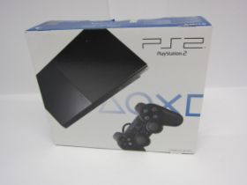 A sealed PlayStation 2 slim games console in charcoal black, SCPH-90004 CB. Still has the