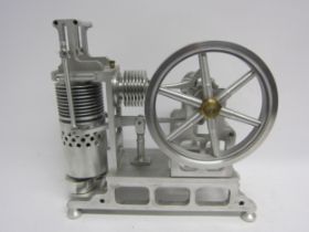 A large polished cast metal model Stirling hot air stationary engine with vertical cylinder
