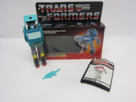 An original 1986 Hasbro Transformers Autobot Warrior 'Kup' housed in original box with instructions.