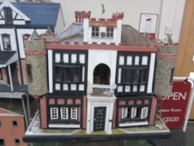 'Glen Reckie House' a large fully furnished dolls house with castellated roof, turrets and wooden