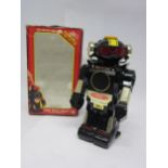A boxed New Bright Tommy The Atomic Robot battery operated plastic robot, 26cm tall.