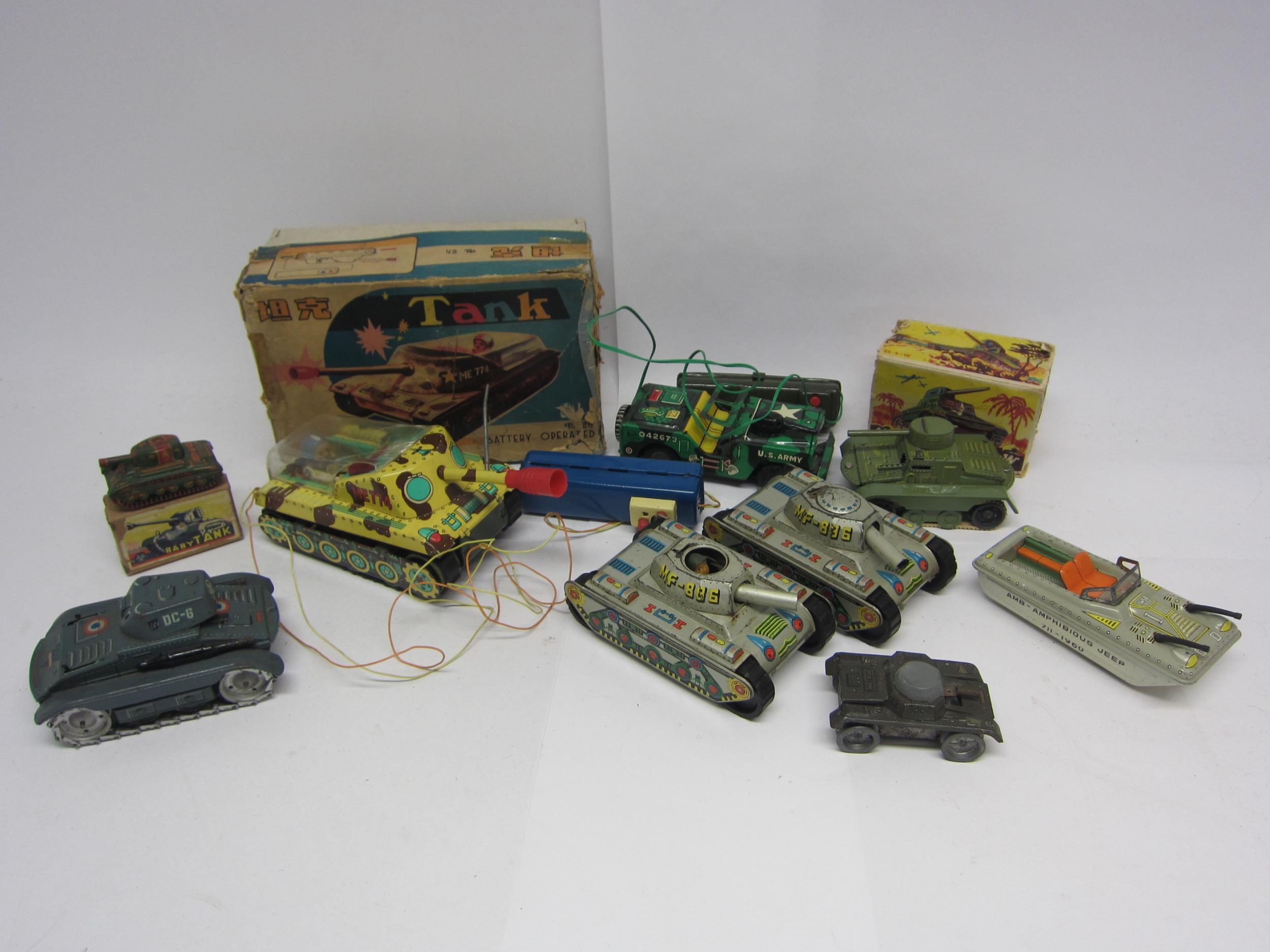 A collection of assorted litho printed tinplate military vehicles to include Arnold (Germany) DC-6