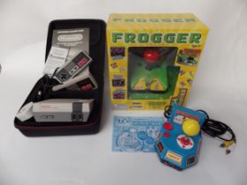 A NES mini containing 30 retro games and two controllers, along with Pac-Man and Frogger TV arcade