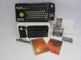 A boxed Sinclair ZX Spectrum 48K personal computer with games to include Fighter Pilot, Halls Of The