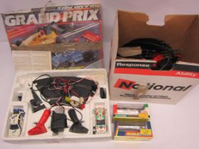 Scalextric Grand Prix slot racing set, spare track and perspex cases