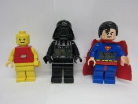 Three large scale Lego figures to include Superman and Star Wars Darth Vader alarm clocks, each