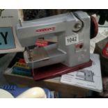 A boxed vintage vulcan classic childs sewing machine
