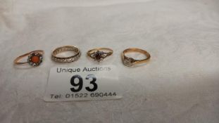 A diamond single stone gold ring, a gold band ring and two other vintage rings, assorted stones.
