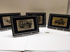 Four framed engravings on silver featuring old forms of transport.