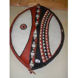 A 20th century leather tribal shield.