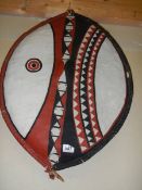 A 20th century leather tribal shield.