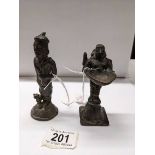 Two oriental bronze figures, 10cm and 12cm.