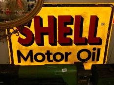 A Shell Motor oil sign.