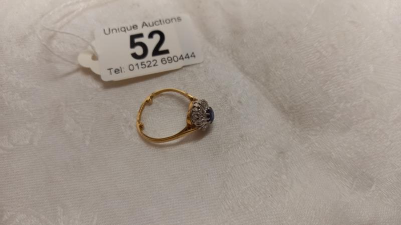 A diamond and sapphire cluster ring, dated and hall marked Birmingham 1967, size N half, 3.4 grams. - Image 2 of 4