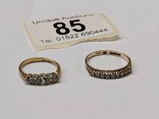 A five white stone set ring, stamped 18ct/plat and a nine white stone ring in 9ct gold, size I & M.