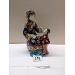 A Japanese figure of a mother/teacher with child.
