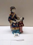 A Japanese figure of a mother/teacher with child.