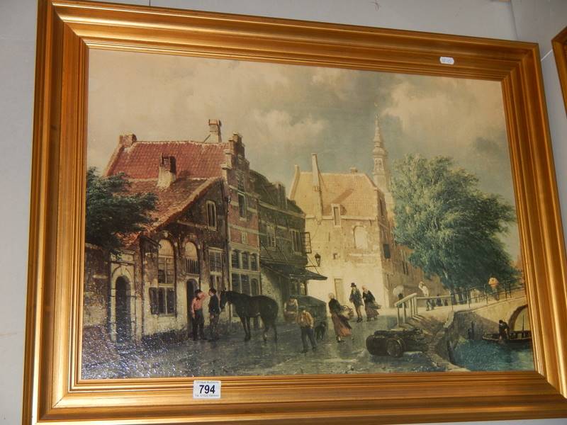 A gilt framed continental scene on canvas.