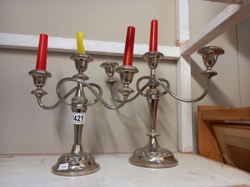 A pair of silver plated candelabra