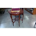 An Edwardian mahogany tea table