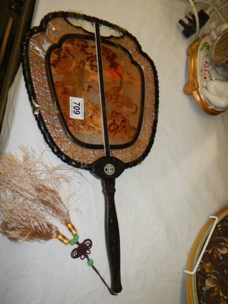 An antique oriental wooden fan. a/f.