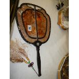 An antique oriental wooden fan. a/f.