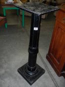 An ebonised torchere. COLLECT ONLY.