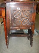 An early Victorian carved single door cabinet.