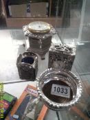 2 small quartz clocks in silver plated cases, + a bottle stand and 1 other item