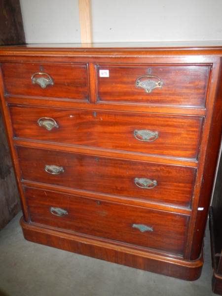 A Victorian mahogany two over three chest of drawers.